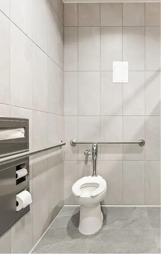 restroom with a white toilet